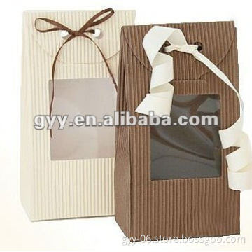 Corrugated paper boxes with die cut window and ribbon